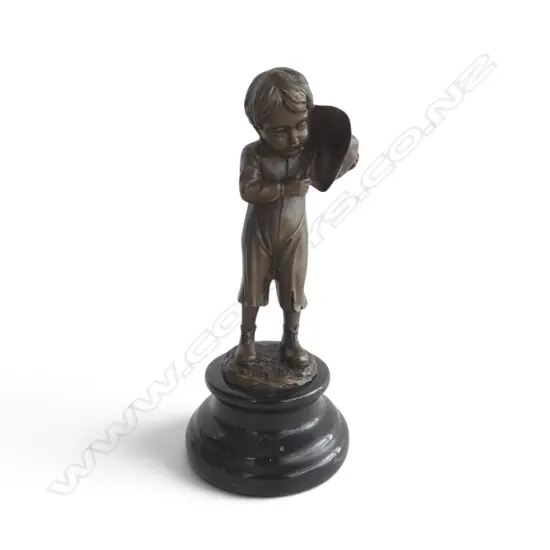 Contemporary bronze 'The Smoker Boy' signed 'Nick' on black marble base. H.215mm. Shielding the flame with his hat.