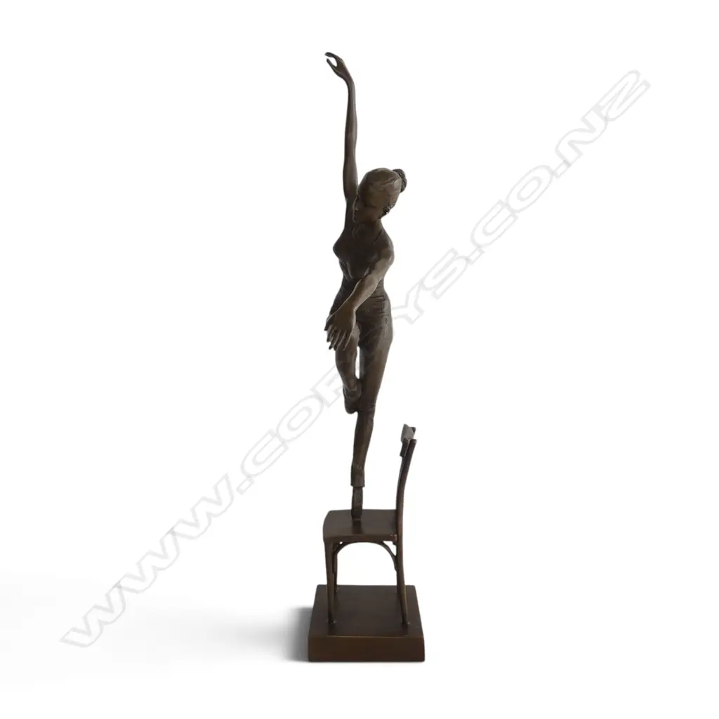 Contemporary bronze of a ballerina dancer on a chair in dynamic pose. The chair signed 'Nick'. H.485mm. Image 1++