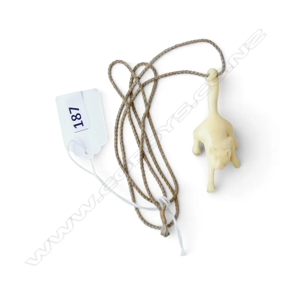 BONE CARVED PENDANT OF A PROWLING CAT. L.65mm Image 1++