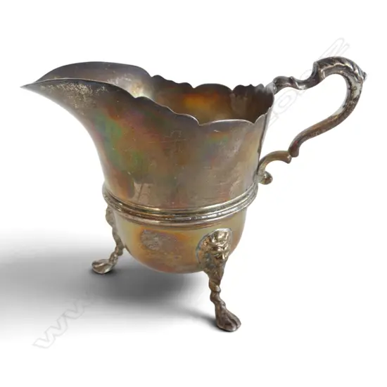 Birmingham 1897 silver tripod cream jug. Lion's head leg mounts. 121gms