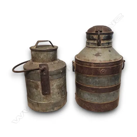 TWO RUSTIC VINTAGE IRON MILK CHURNS