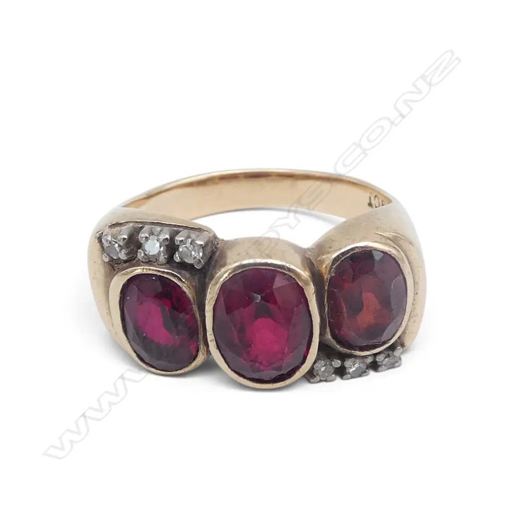 9ct Gold and ONE facet cut garnet with two red stones ring with six small diamonds. 6.48gms Image 1++