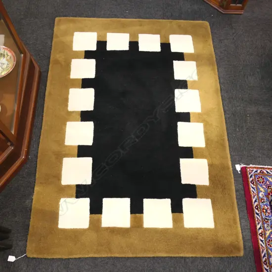 PURE WOOL HAND MADE BARRY SALOMON'S GOUGER RUG. 1100 X 1600MM