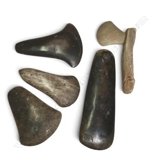 5 VARIOUS MELANESIAN POLISHED STONE ADZES, ONE WITH WOODEN HANDLE, LONGST 250MM