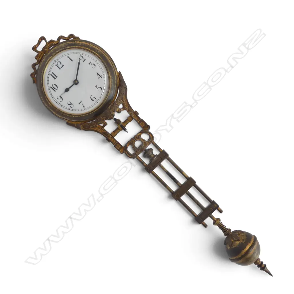 ART DECO STYLE BRONZED SPELTER MYSTERY CLOCK mounted to turned wood base, signature H.390mm Image 1++