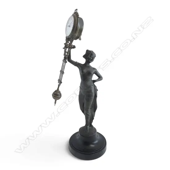 ART DECO STYLE BRONZED SPELTER MYSTERY CLOCK mounted to turned wood base, signature H.390mm