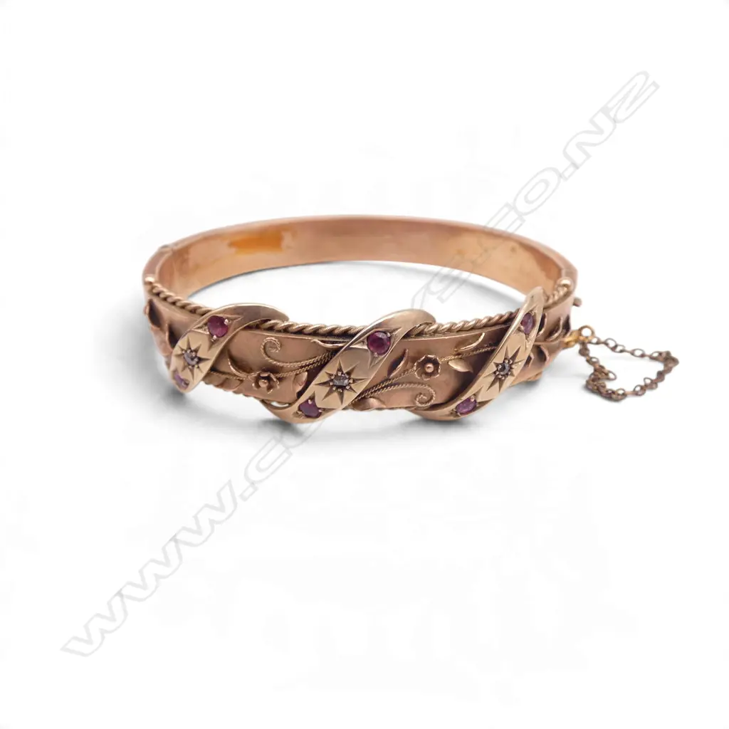 9ct ROSE GOLD RUBY & DIAMOND HINGED BANGLE 13.59gm, hallmarked, dents to underside Image 1++