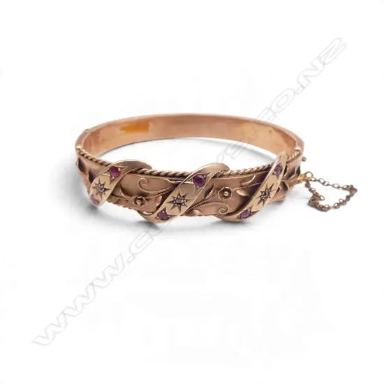 9ct ROSE GOLD RUBY & DIAMOND HINGED BANGLE 13.59gm, hallmarked, dents to underside