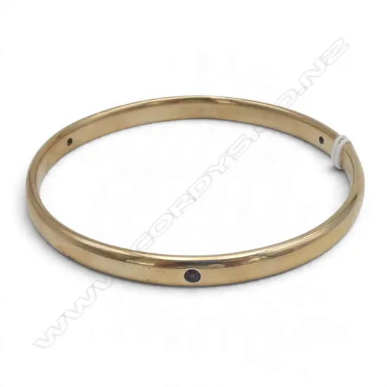 9CT with 3 small RUBYS SHOT SET INTO BANGLE 31.7gms 6.2MM diam.