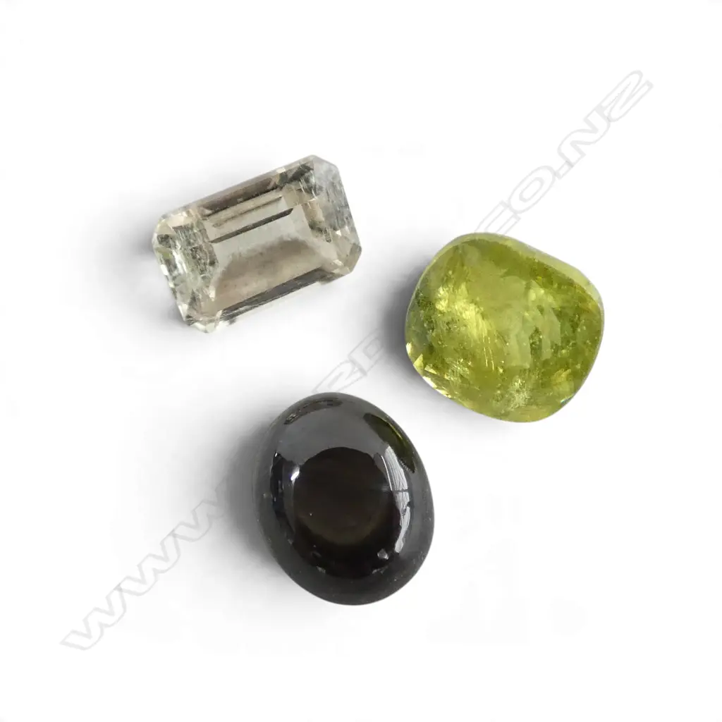 3 LOOSE GEMSTONES; BLK STAR SAPPHIRE, EMERALD CUT DIASPORE & CUSHION CUT SPHENE Image 1++