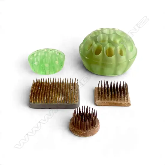 FIVE FLOWER FROGS - 2 GREEN GLASS AND 3 METAL (ONE MAYBE URANIUM), L.40MM-110MM