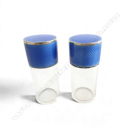 Pair of Asprey & Co Ltd (London 1910) BLUE ENAMELLED SILVER TOP GLASS VANITY BOTTLES minor loss to edge of one. H.60mm.