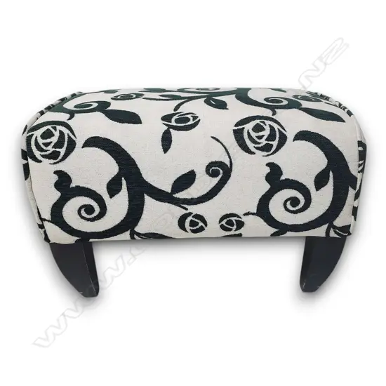 OTTOMAN WITH GREEN FLORAL AND CURLING VINE PATTERN ON AN OFF-WHITE GROUND