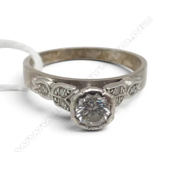 18CT WG & SOLITAIRE DIAMOND RING with shoulder diamonds 4gms SIZE P (Estimated diamond size 0.40ct)