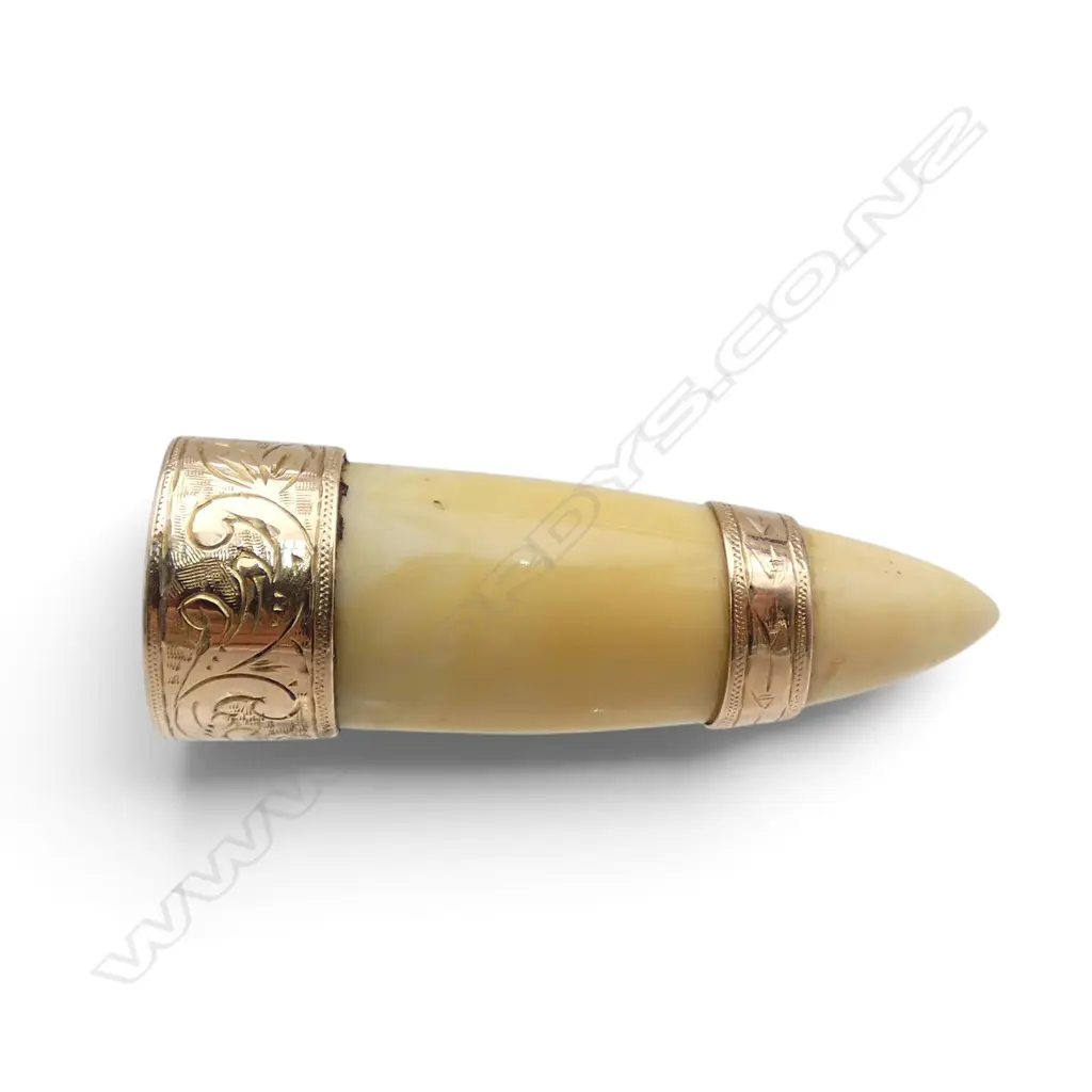 c.1900 9ct rose gold and marine ivory small tooth brooch, engraved cap mount. L.45mm Image 1++