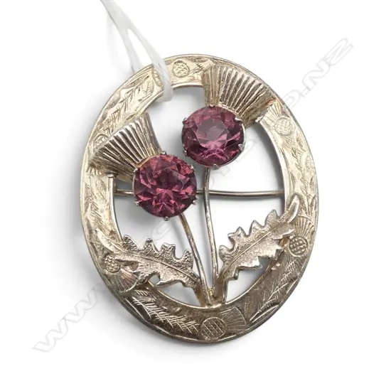 EARLY 20thC SILVER PLATE SCOTTISH THISTLE BROOCH w 2 purple stones. Engraved decoration
