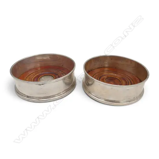 PAIR STG SILVER & MAHOGANY WINE BOTTLE COASTERS LONDON 2004, total 194gms, small crease to one, Dia.103mm, H.37mm