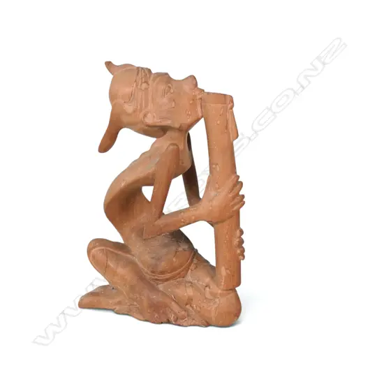 VINTAGE HAND CARVED BALINESE SCULPTURE OF A MUSICIAN PLAYING THE FLUTE, 230 X 155MM
