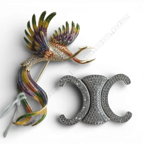 2 COSTUME BROOCHES; CELINE LOGO & PHOENIX L.70mm
