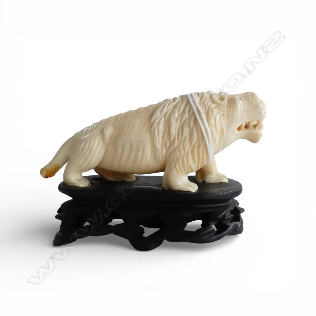 VINTAGE SOLID IVORY CARVED LION SCULPTURE tail end broken. On carved wood base. L.90mm Image 1++