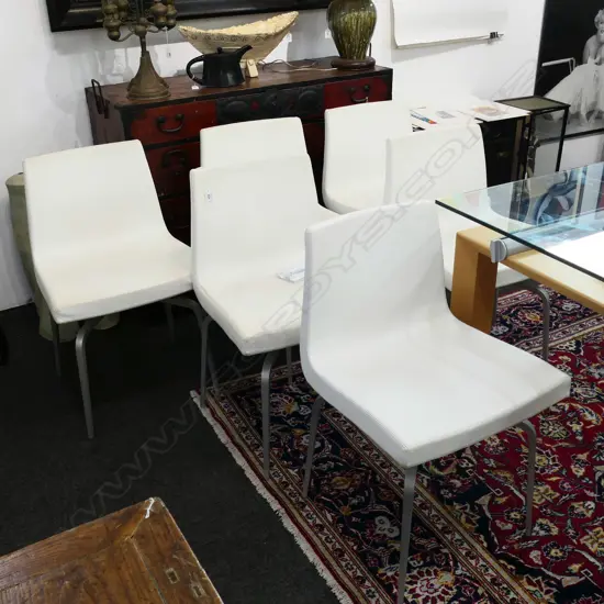 6  MODERN WHITE VINYL DINING  CHAIRS ON SWIVEL BASES STAMPED 'ATELIER'