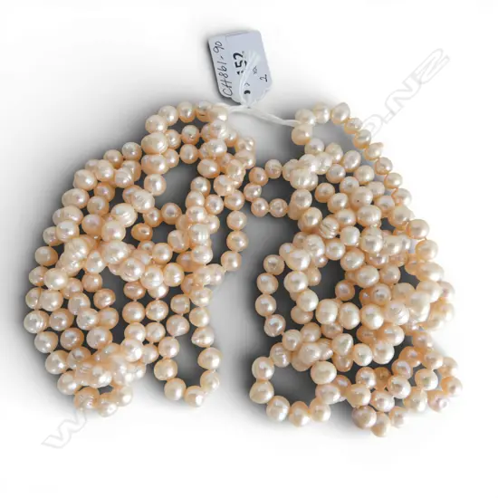 2 STRANDS OPERA LENGTH FRESH WATER CULTURED SOFT PEACH COLOURED PEARLS, new old stock