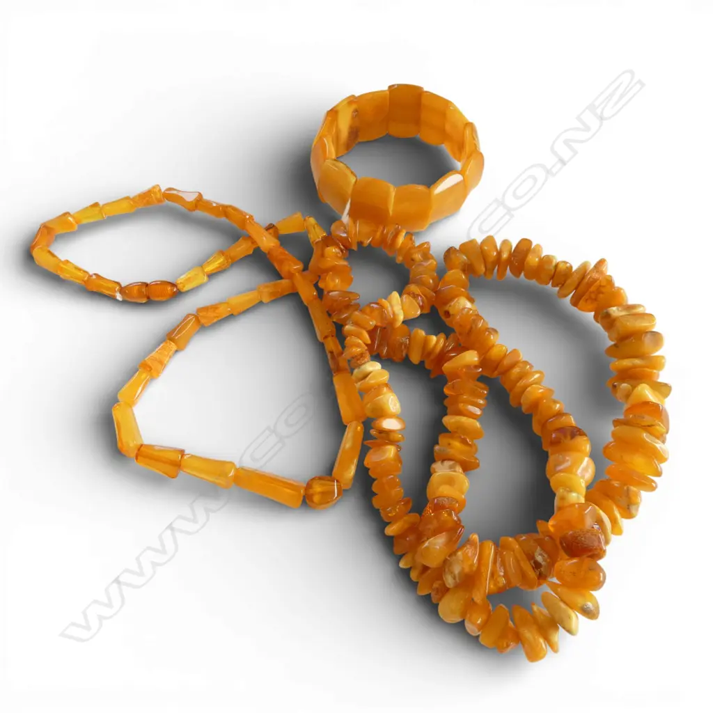 TWO AMBER NECKLACES & A BRACELET From the estate of jeweller Simon Misdale` Image 1++