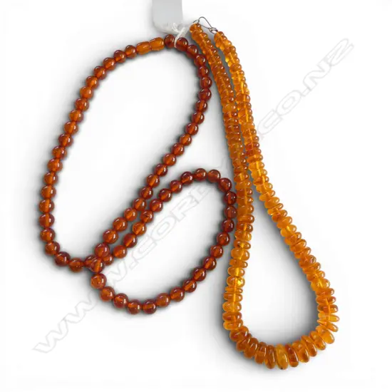 TWO AMBER BEAD NECKLACES From the estate of Simon Misdale