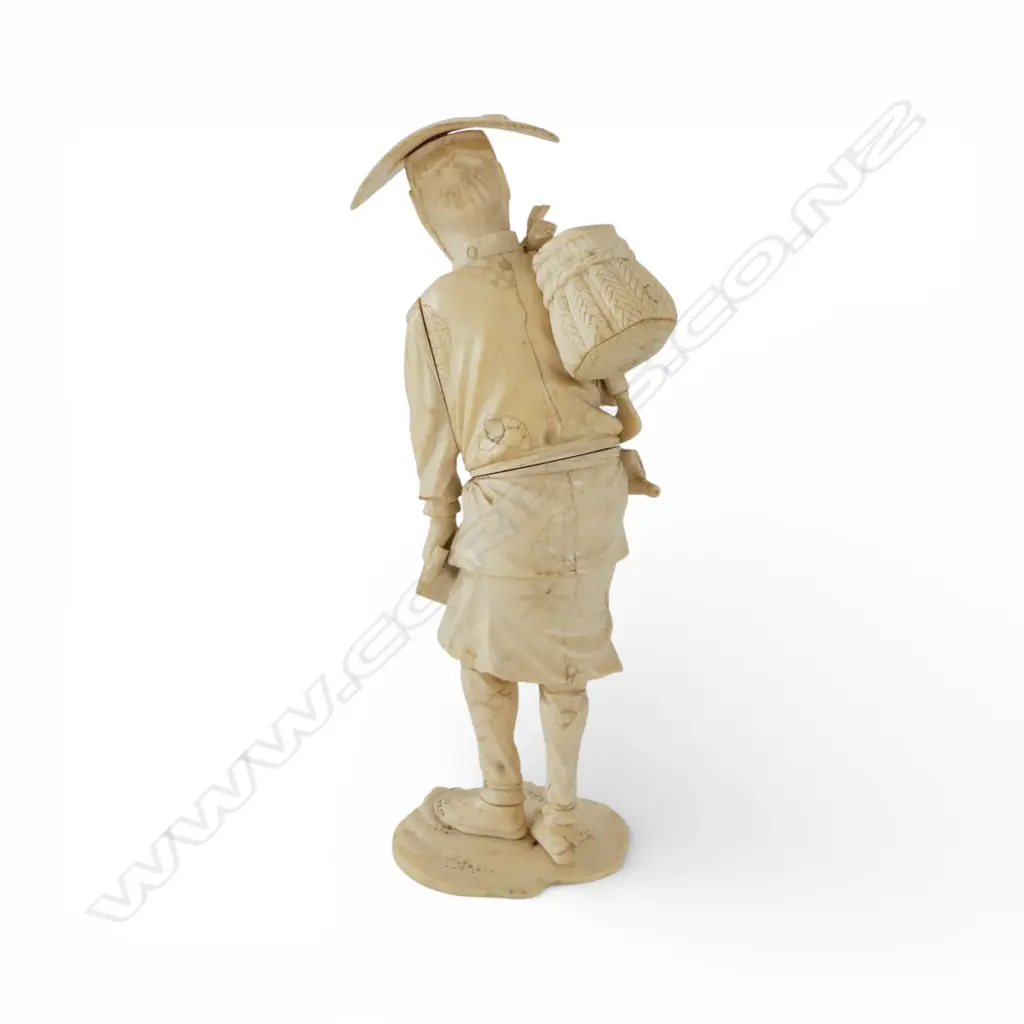 JAPANESE IVORY FIGURE; MAN CARRYING SACK OVER SHOULDER H.225mm SIGNED TO BASE Image 1++
