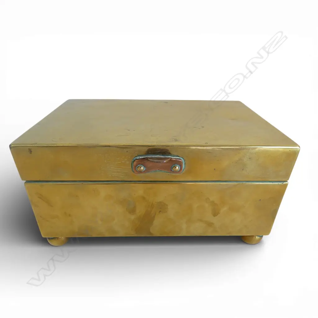 A hammer finished brass hinged lid box with copper handle W.180mm Image 1++