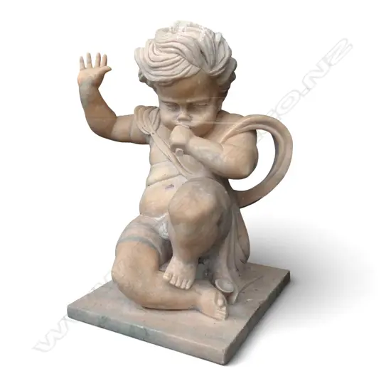 Large carved orange marble statue of a cherub with trumpet, trumpet damaged. H800mm