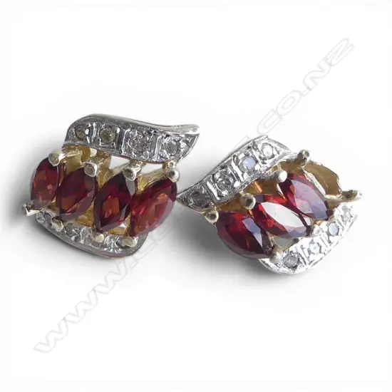 9ct pair garnet/ diamonds stud earrings. 1 garnet missing. 4.1gms