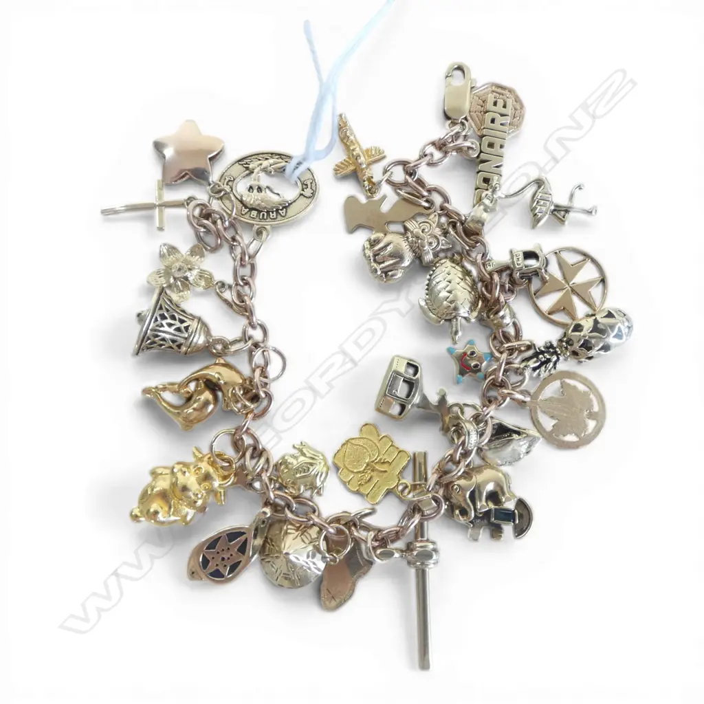 9ct CHARM BRACELET (ALL CHARMS GOLD: various 9ct to 23.9ct) 37.8gms Image 1++