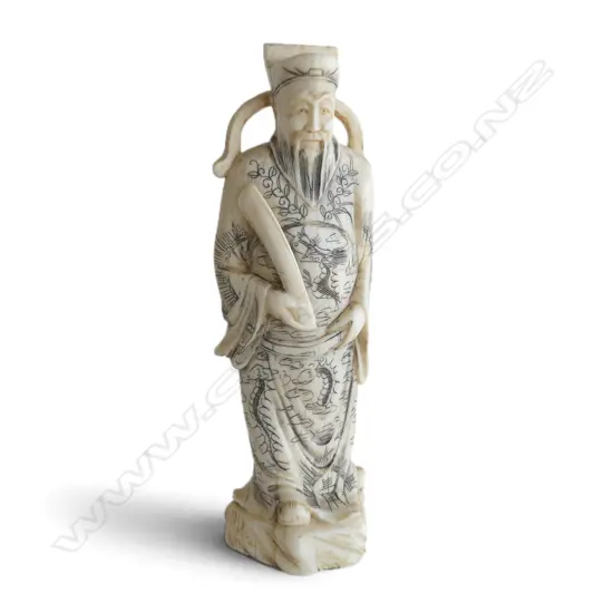 OLD MARINE IVORY CHINESE STANDING DEITY FIGURE with black stained highlights  H.155mm