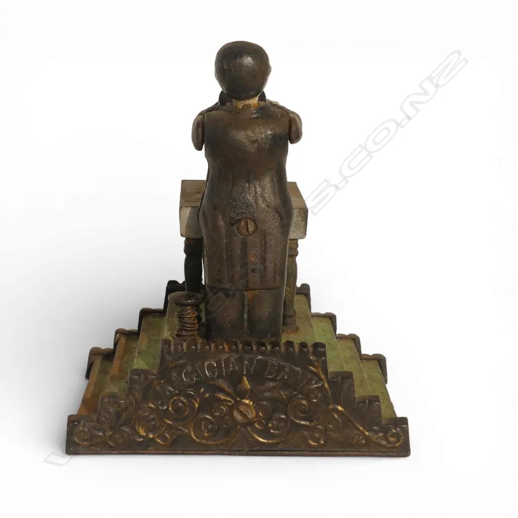 ANTIQUE CAST IRON MECHANICAL 'MAGICIAN BANK' MONEY BANK missing bottom coin plate H.200mm Image 1++