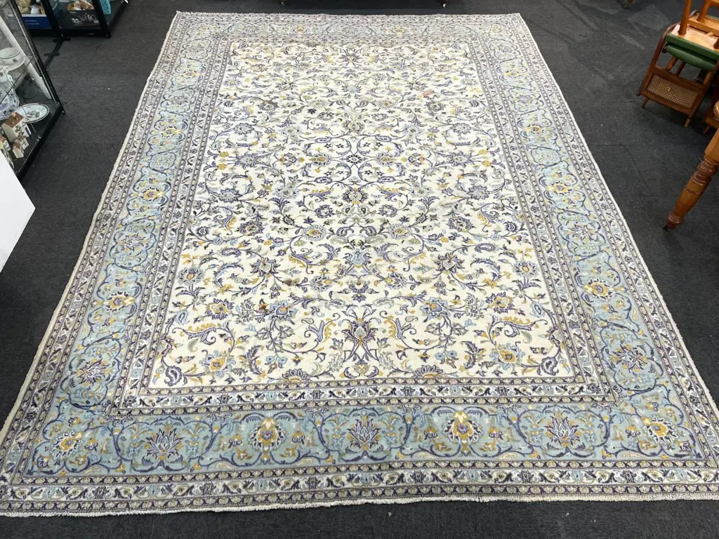 Very large Iranian hand knotted Kashan carpet curvilinear designs pale tones. 4100 x 3000mm. Some fading & insect damage Image 1++