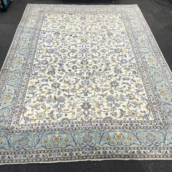 Very large Iranian hand knotted Kashan carpet curvilinear designs pale tones. 4100 x 3000mm. Some fading & insect damage