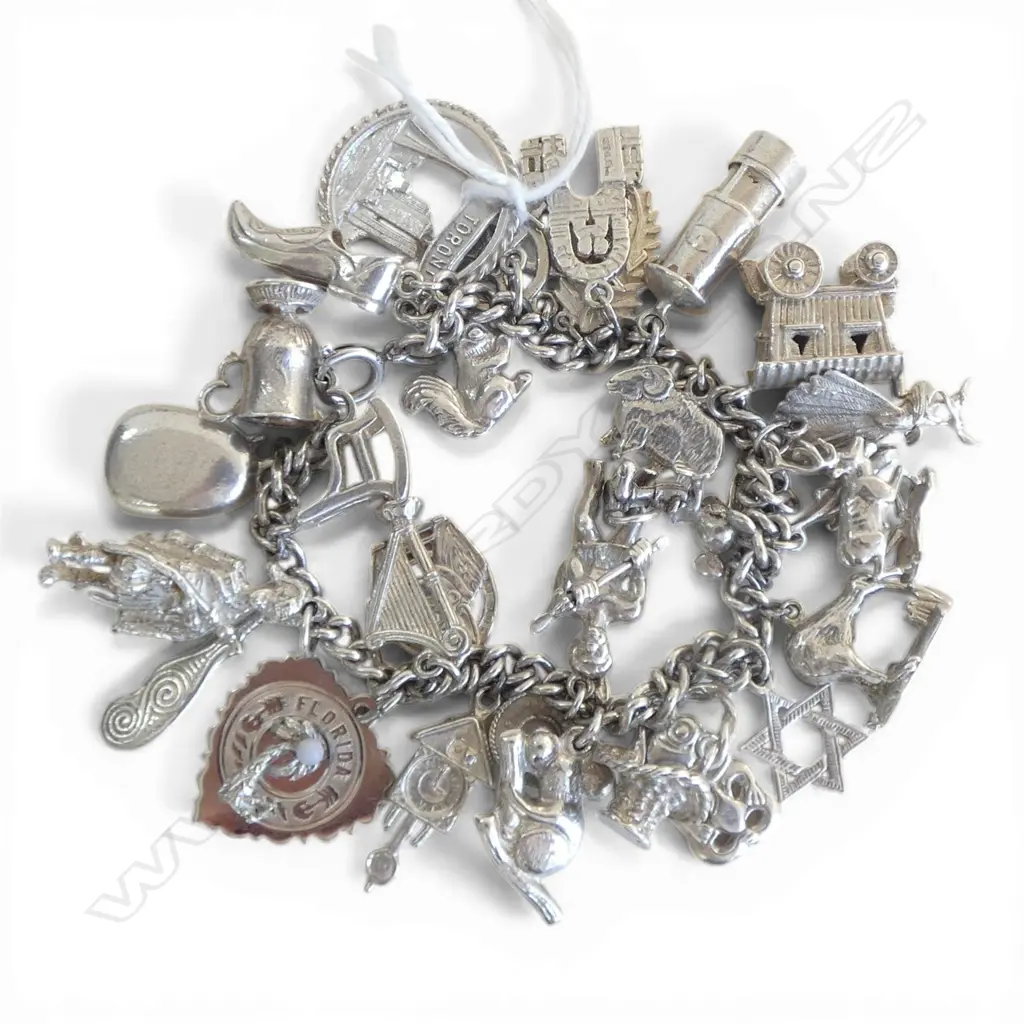 STG SILVER CHARM BRACELET, 90.56gm, silver mark on most charms Image 1++