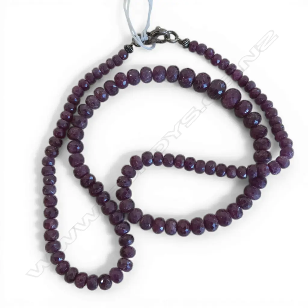 STRING OF FACETED RUBY BEADS ON S/SILVER CLASP Image 1++
