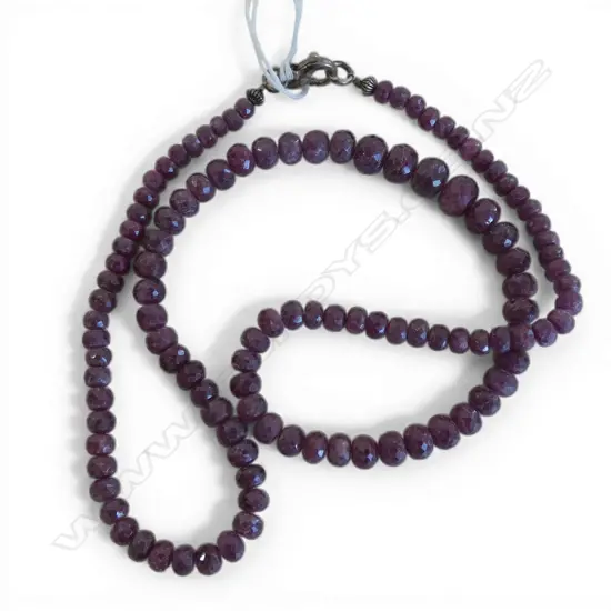 STRING OF FACETED RUBY BEADS ON S/SILVER CLASP
