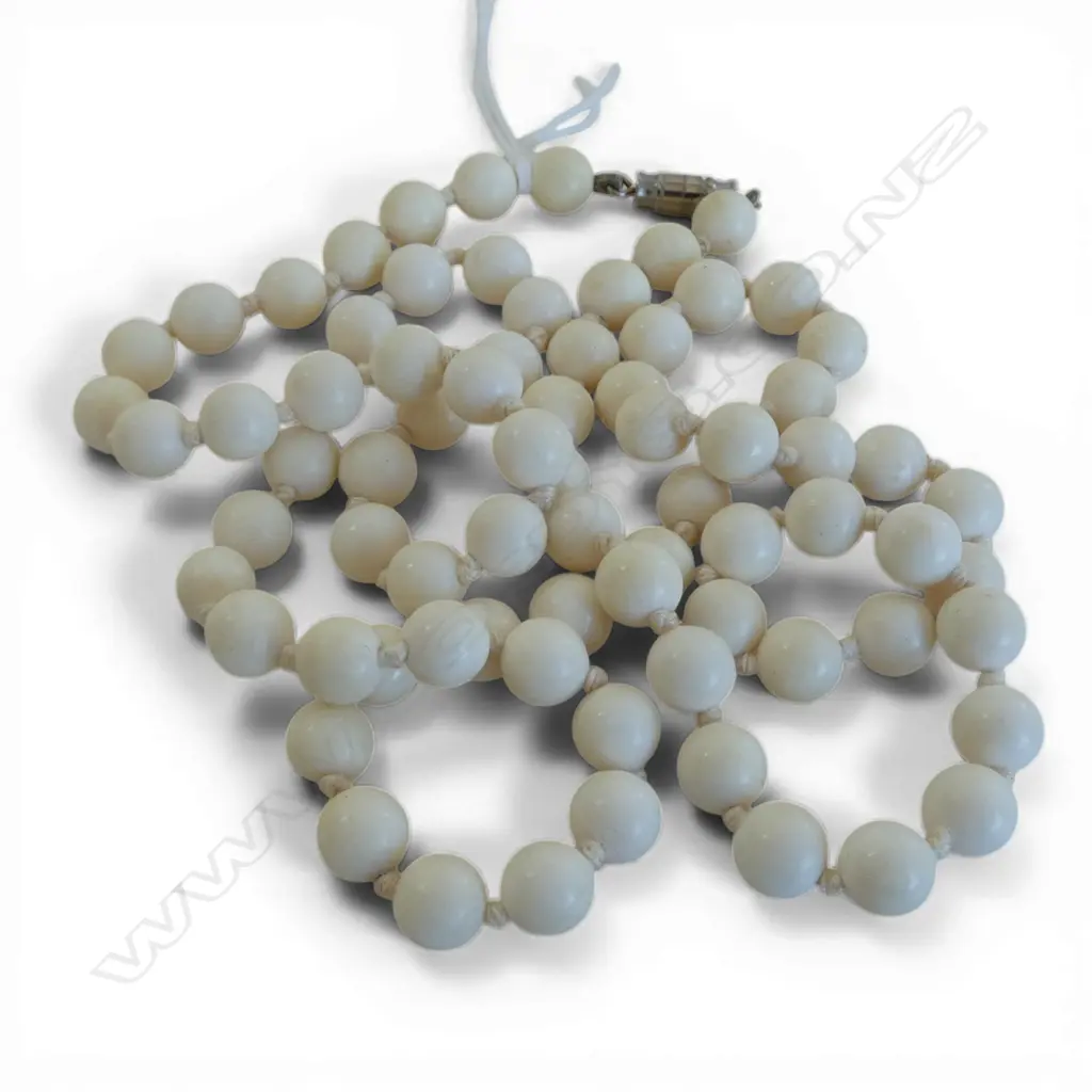 STRING OF HAND NOTTED IVORY BEADS Image 1++