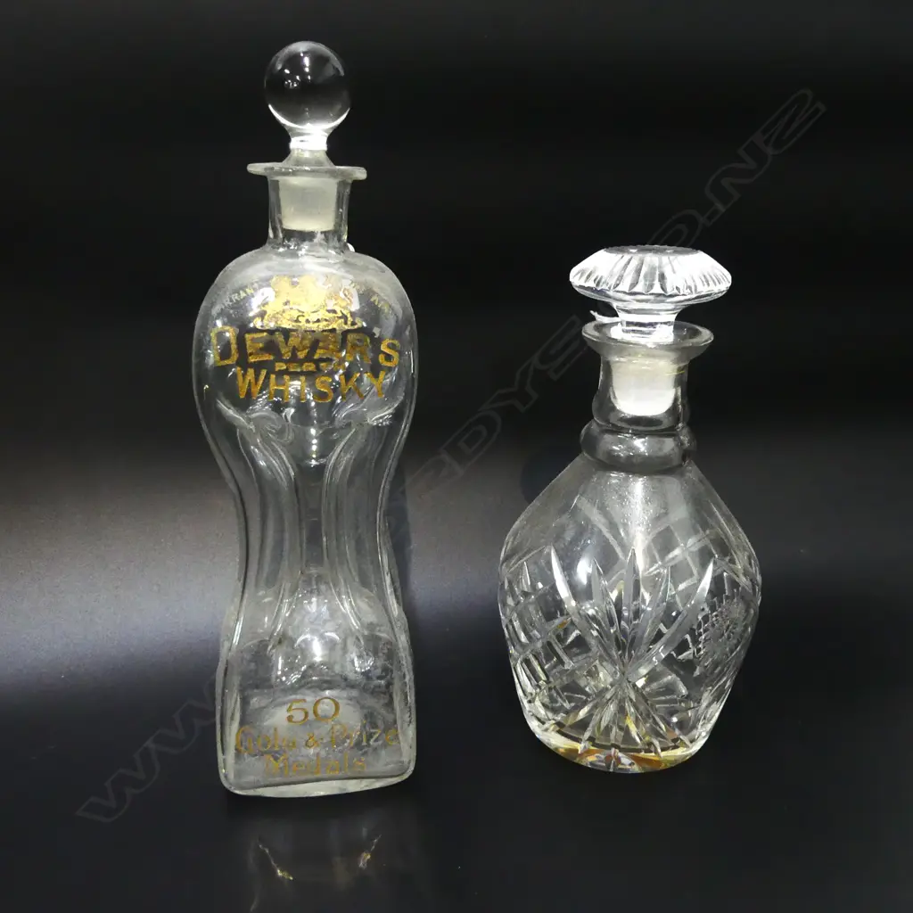 2 VINTAGE DECANTERS: 1 cut crystal the other 'Dewar's whisky' engraved named & gilded.  Image 1++