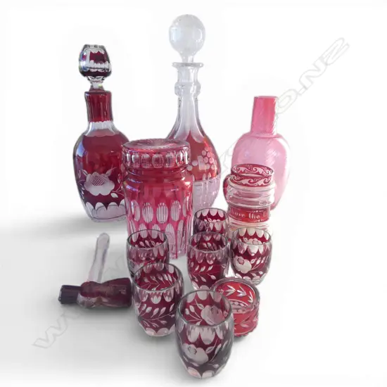 COLLECTION OF RUBY GLASS DECANTERS GLASSES LIDDED JAR ETC
