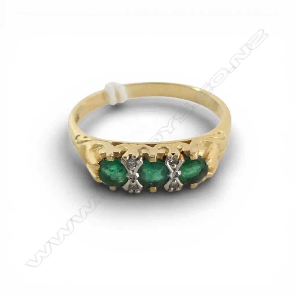 18CT 3 EMERALD & SMALL DIAMOND DRESS RING, 3.9gms SIZE Q1/2 Image 1++