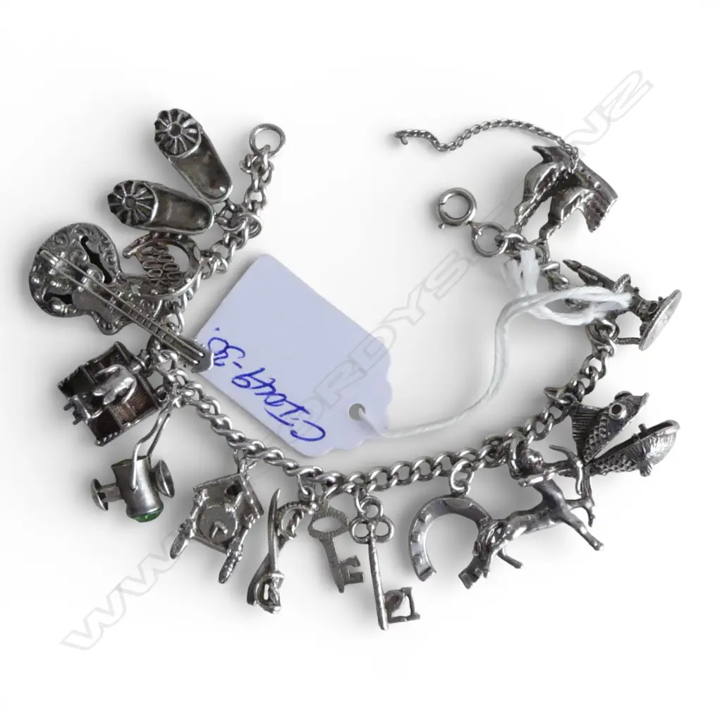 SILVER CHARM BRACELET piano player + hinged fish + guitar + centaur + clock etc 48gms Image 1++
