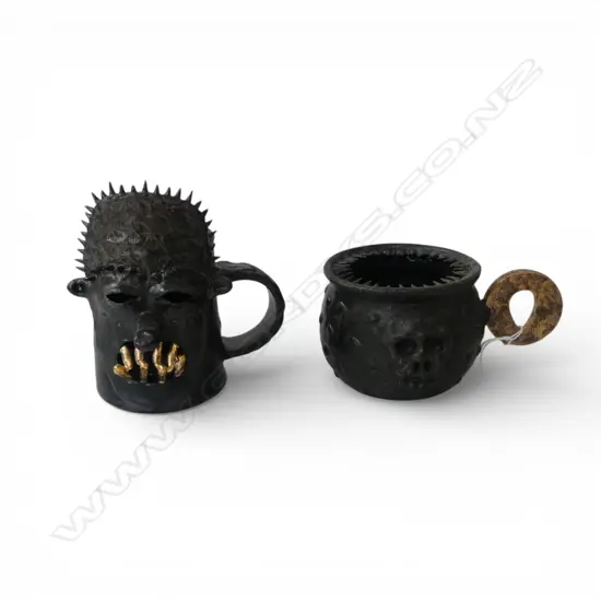 2 LAURIE STEER STUDIO POTTERY MUGS skull cup w. small chips to spikes H.140mm