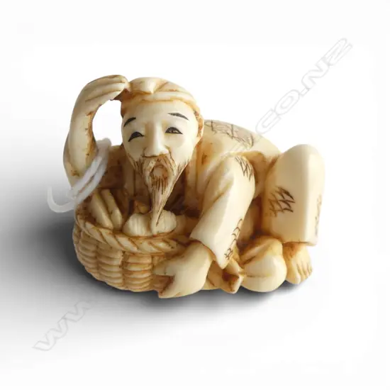 JAPANESE CARVED IVORY NETSUKE shopkeeper, signed L.35mm