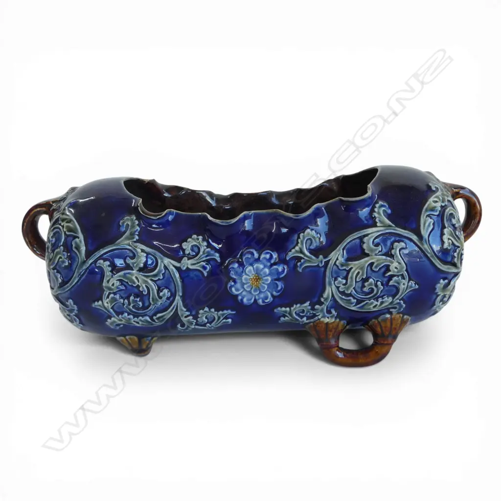 # Royal Doulton stoneware blue ground trough vase,  leafy scroll decoration, brown lug feet. L.290mm. minor chipping Image 1++