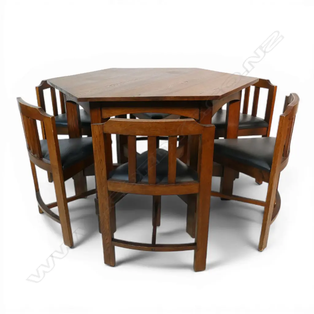 An uncommon Arts & Crafts oak hexagonal table and six shaped chair set, Image 1++