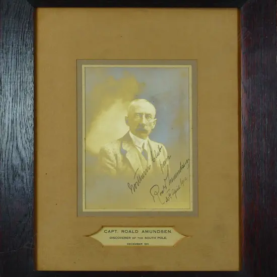 A rare presentation signed portrait photograph of explorer Roald Amundsen by Herman John Schmidt. Signed in ink and dated 30th April 1912